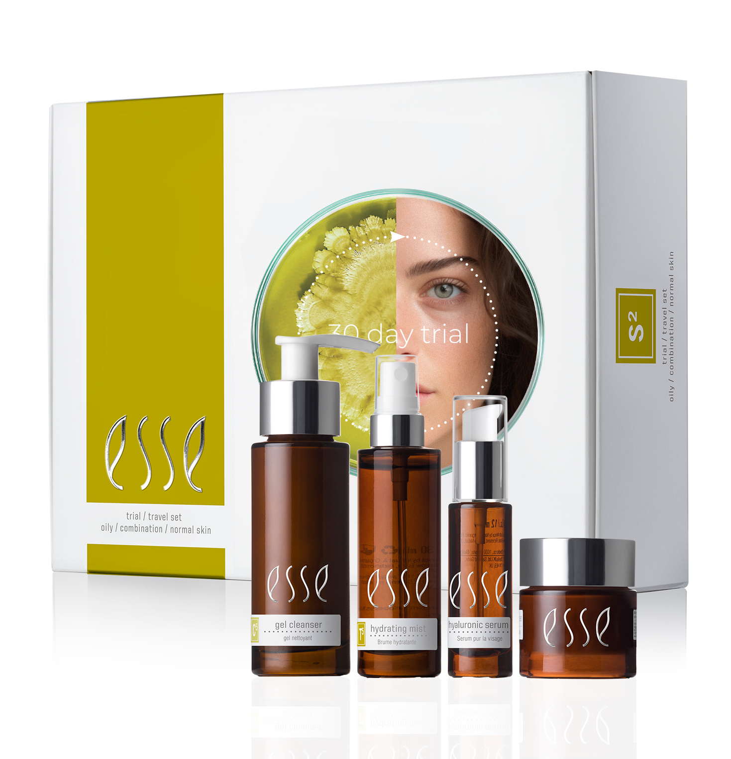 The Esse Oily / Combination / Normal Trial / Travel Set features four brown bottles with white text and pumps, housed in a white and green box displaying an image of a woman partially obscured behind a leaf. This skincare set includes a gel cleanser, hydrating serum, and hyaluronic serum.