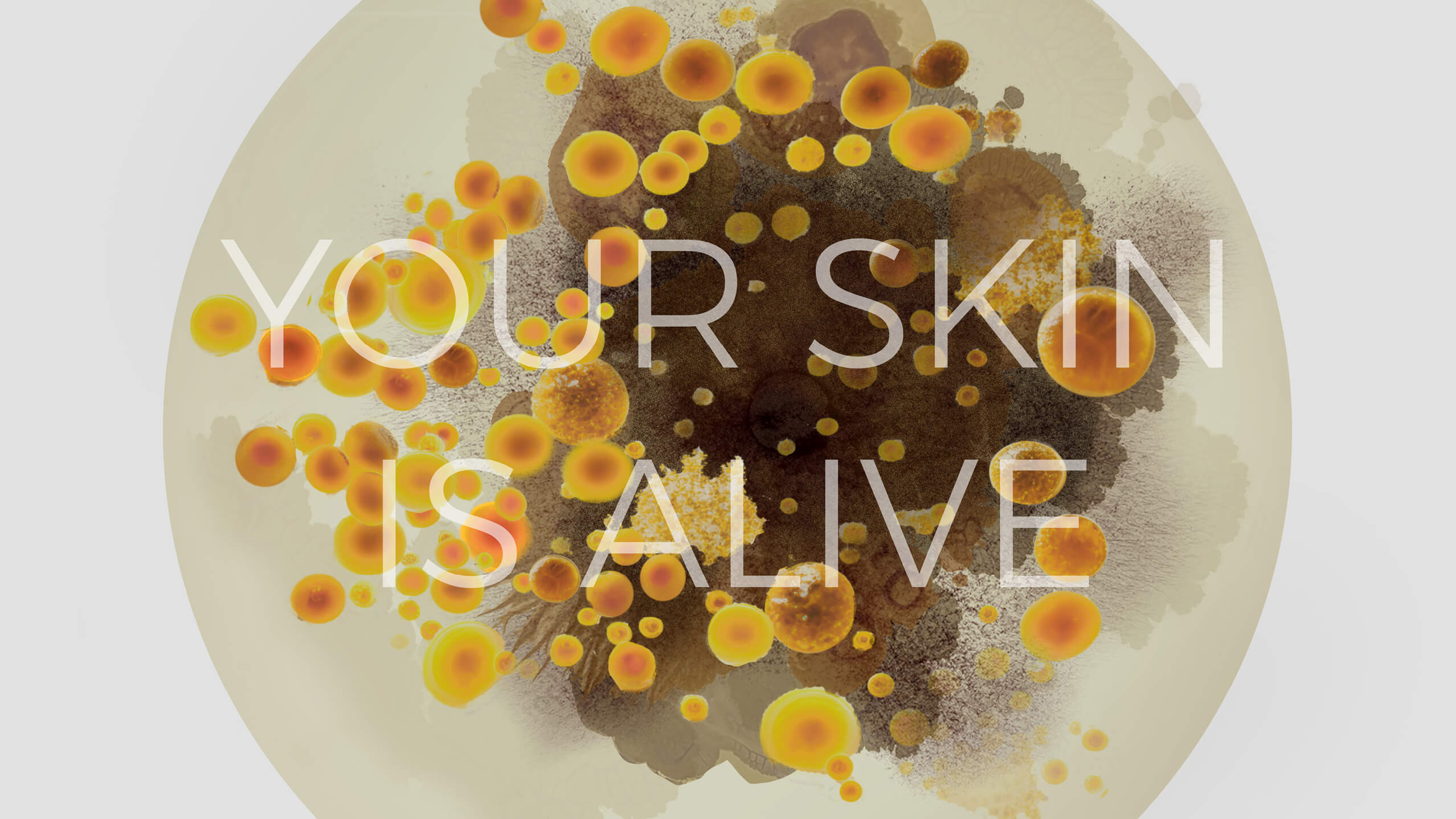 A background of overlapping orange, yellow, and brown circles resembling cells, with the white text "YOUR SKIN IS ALIVE" overlaid in the center.