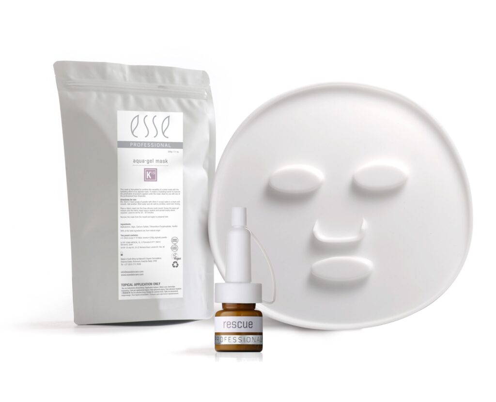 White sachet labeled "esse Professional Aqua Gel Mask" next to a round, white face-shaped mask and a small dropper bottle labeled "rescue PROFESSIONAL." The products are set against a plain white background.